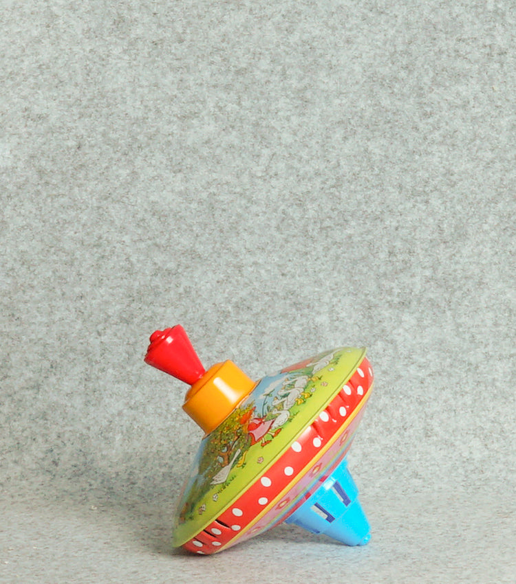 "Trottola Vintage a Carica con le Paperelle" in plastica e metallo