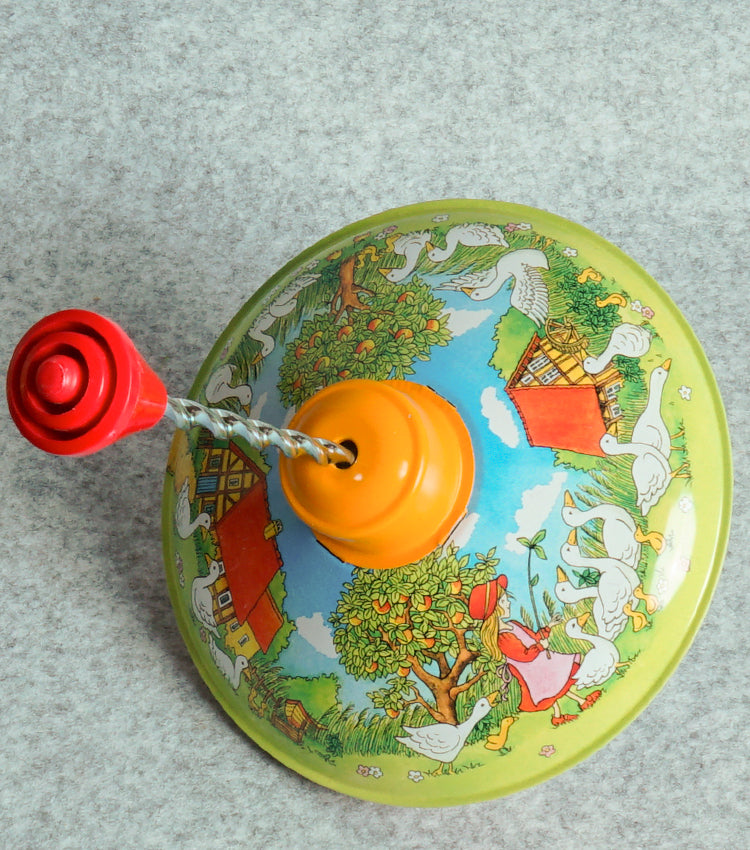 "Trottola Vintage a Carica con le Paperelle" in plastica e metallo