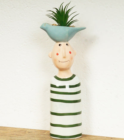 "Busto di un Bambino con un Vaso sopra la testa" in ceramica