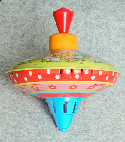 "Trottola Vintage a Carica con le Paperelle" in plastica e metallo