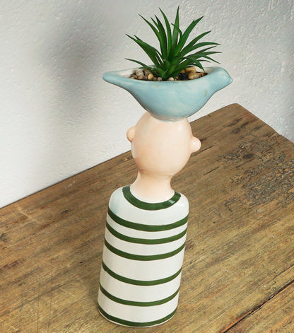 "Busto di un Bambino con un Vaso sopra la testa" in ceramica