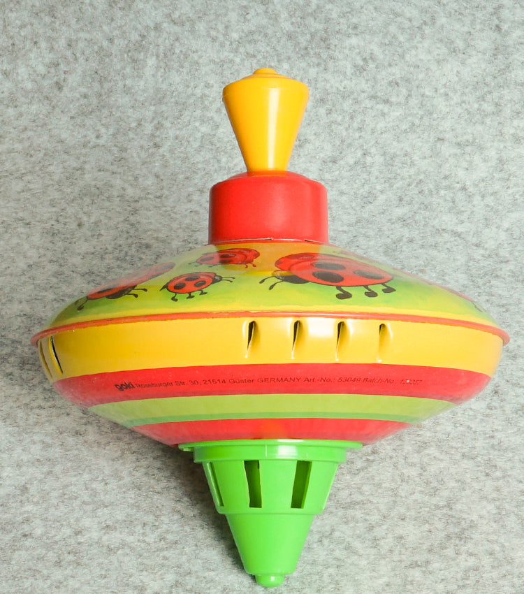 "Trottola Vintage a Carica con le Coccinelle" in plastica e metallo