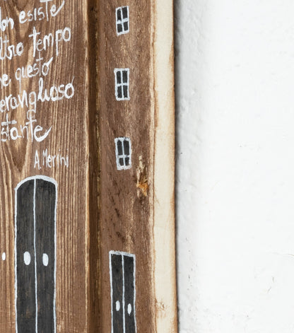 Case con un aforisma di Alda Merini in legno