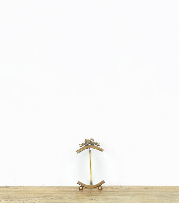 Cornice porta-foto rotonda in vetro e ottone